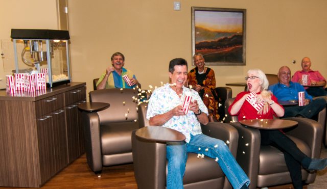 Residents Eating Popcorn at Theater