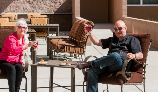 Couple on Patio Enjoying Wine